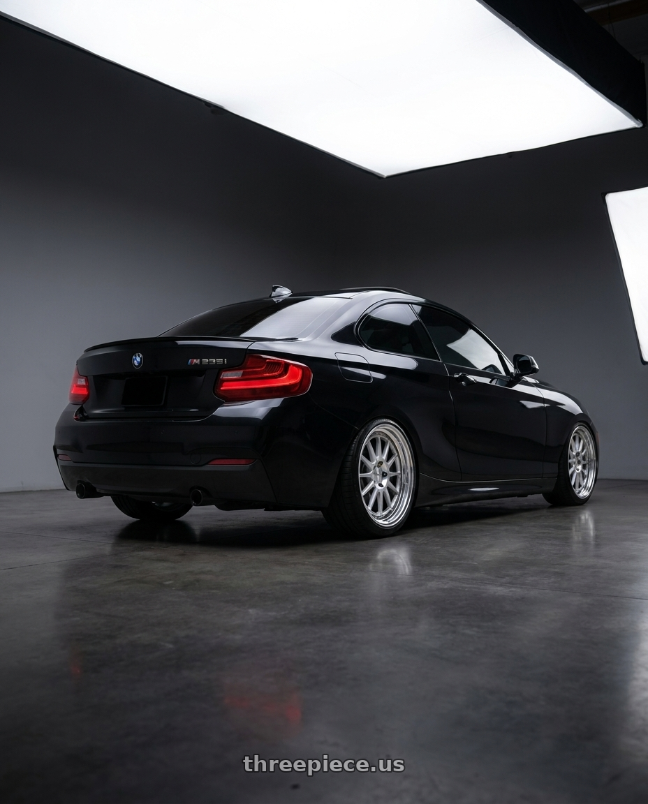 2015 bmw m235i with Work Seeker Fx 5x120 17x7.5+30 A Disk Matte Silver Polish wheels rear three quarter view slight stretch tires