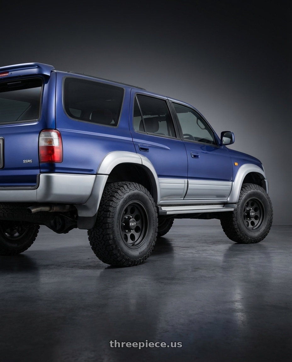 1996 Toyota Hilux Surf SSRG Blue with Mickey Thompson Classic III Black 6x139.7 17x9 -12 Matte Black wheels rear three quarter view meaty tires