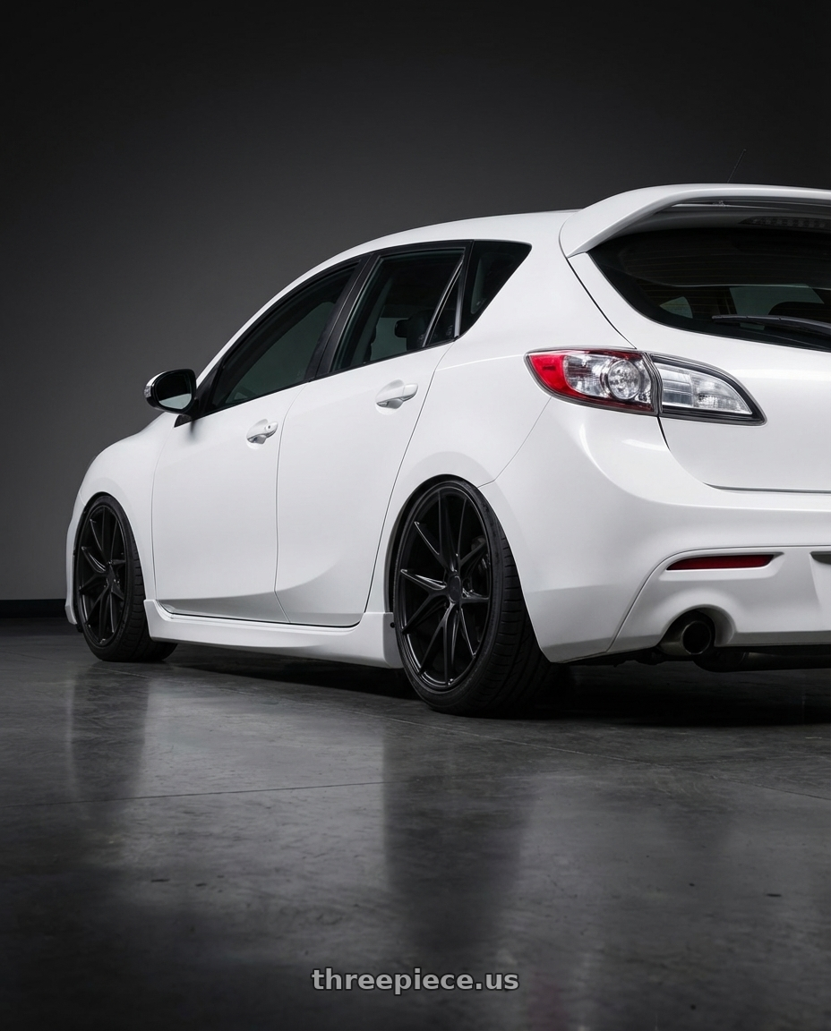 2012 Mazda Mazdaspeed3 with Niche 1PC M117 MISANO 5X114.3 18X9.5 +40 MATTE BLACK wheels rear three quarter view slight stretch tires