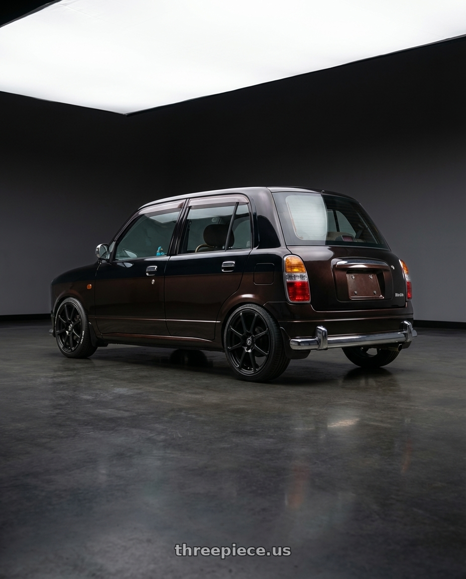 2000 Daihatsu Mira Gino  with Enkei EDR9 4x100/114.3 15x6.5+38 Black wheels rear three quarter view slight stretch tires