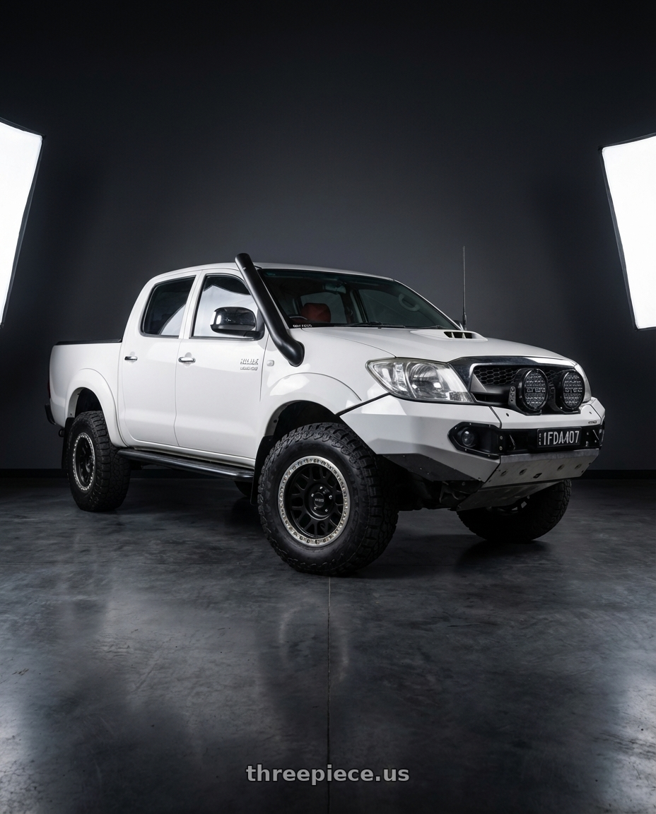 2009 Toyota Hilux SR5 white with KMC KM234 GRENADE DESERT BEADLOCK 6X139.7 17X8.5 +0 SATIN BLACK wheels