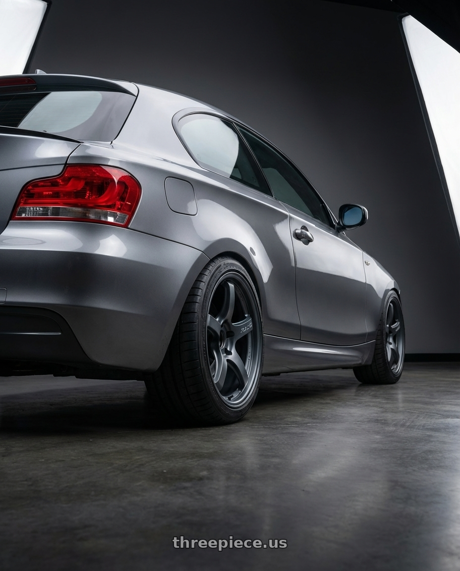 2012 BMW 1 Series E82 with Gram Lights 57CR 5x120 18x9.5+38 Gunblue II wheels rear three quarter view square tires