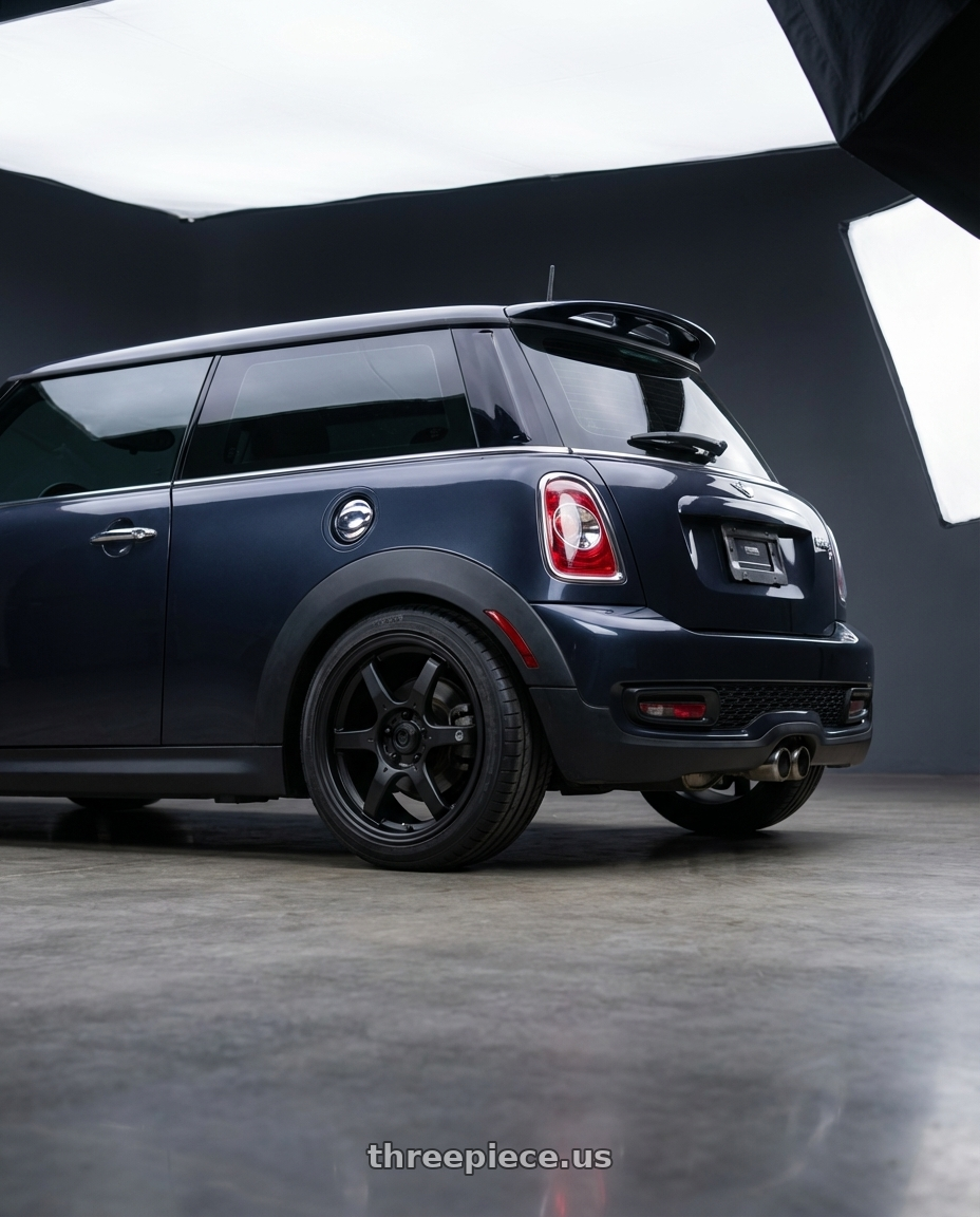 2010 Mini Cooper S R56 with Konig Backbone 4x100 17x7.5+45 Matte Black Milling Logo on Spoke wheels rear three quarter view square tires