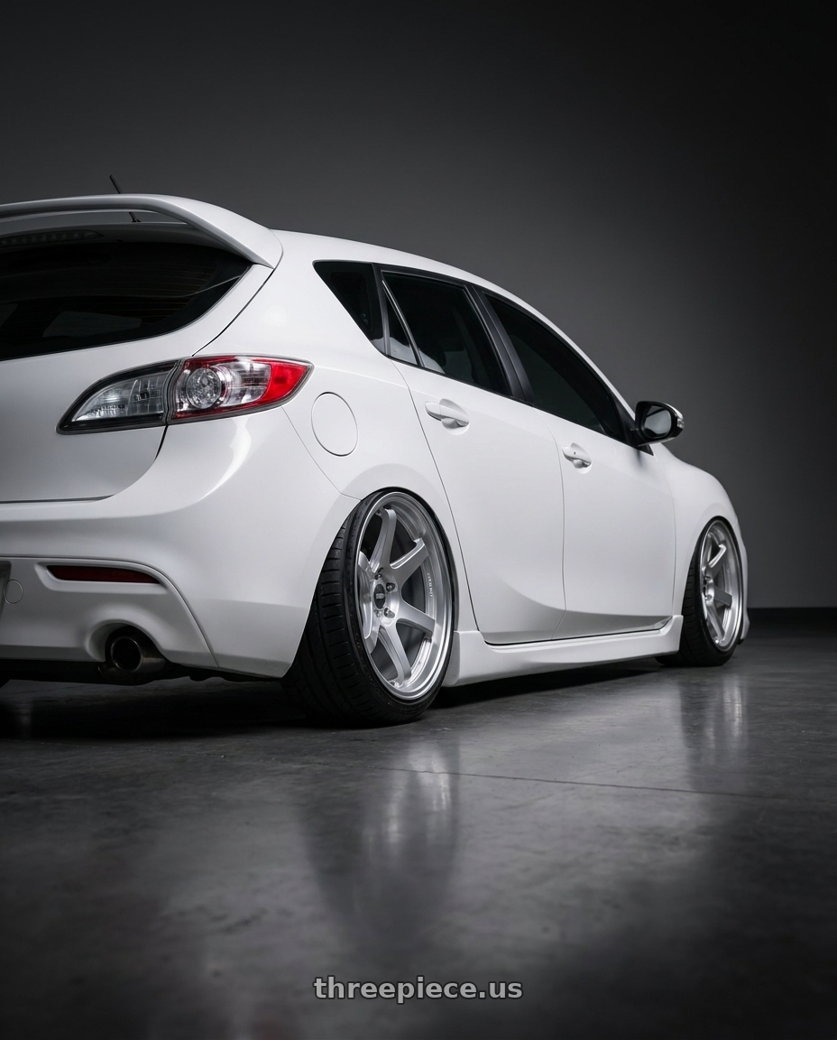 2012 Mazda Mazdaspeed3 with ESR Wheels APEX SERIES AP6 5x114.3 18x9.5 +22 Hyper Silver wheels rear three quarter view slight stretch tires