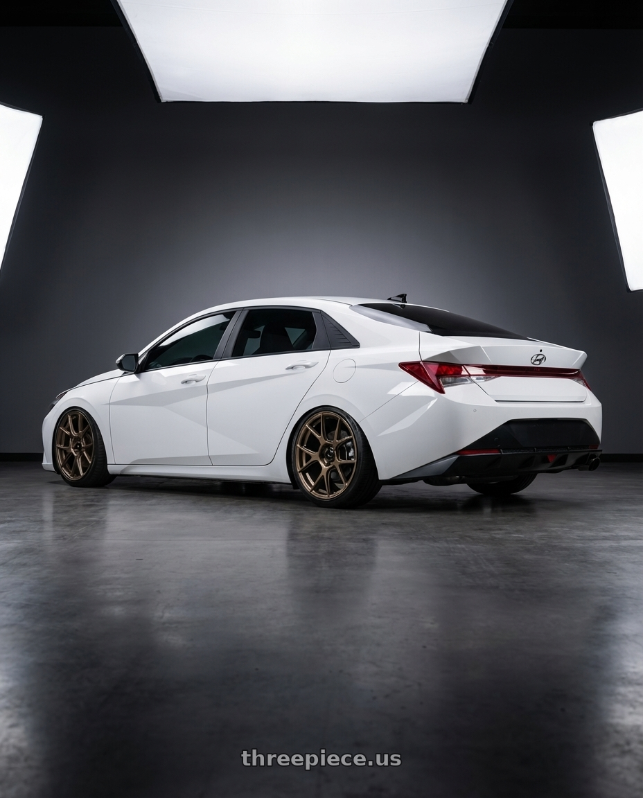 2024 Hyundai Elantra N with Konig Ampliform 5x114.3 19x9.5+35 Gloss Bronze wheels rear three quarter view slight stretch tires
