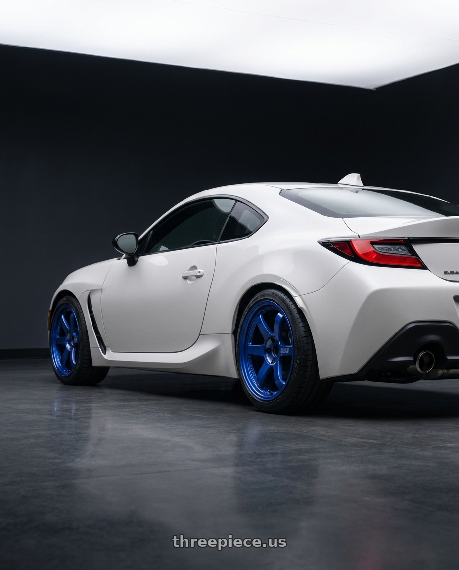 2025 Subaru BRZ TS White with Volk Racing TE37SL 5x100 18x8.5+35 Hyper Blue wheels rear three quarter view slight stretch tires
