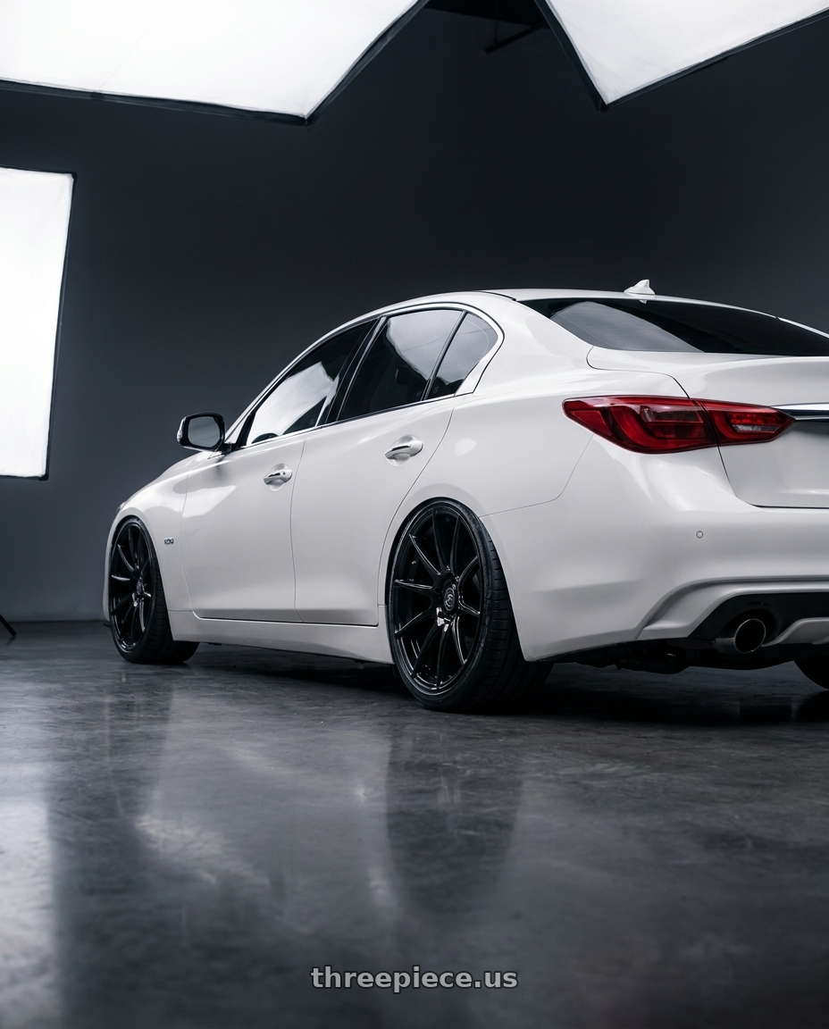 2020 Infiniti Q50 with Forgestar CF10 5x114.3 20x9 +35 Gloss Black wheels rear three quarter view slight stretch tires