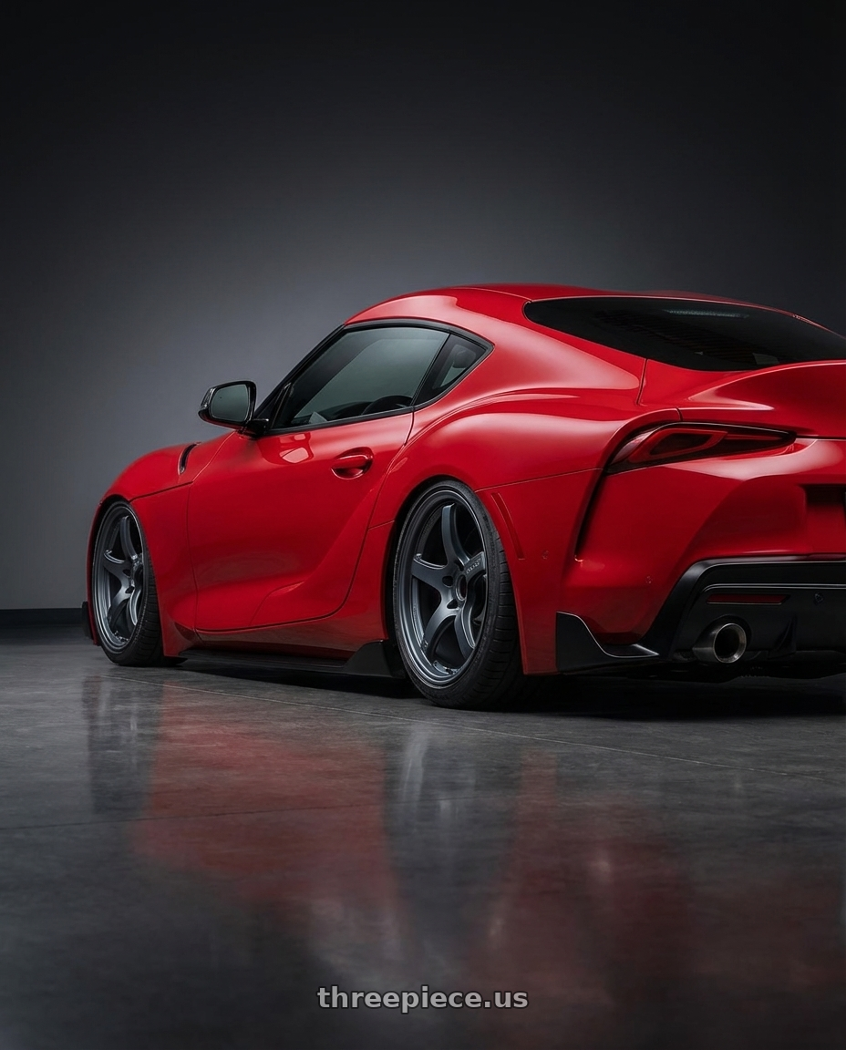 2023 Toyota GR Supra with Gram Lights 57CR 5x112 19x8.5+45 Gunblue II wheels rear three quarter view slight stretch tires