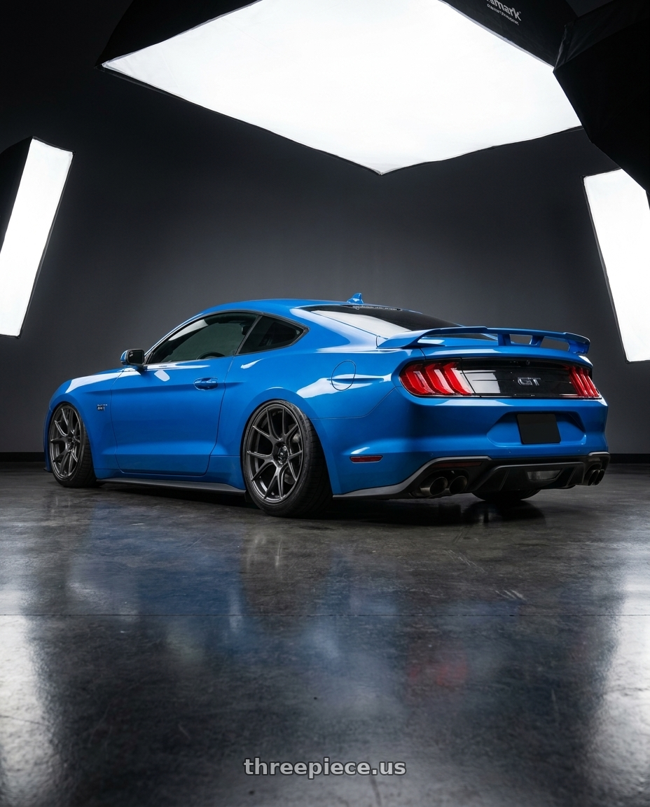 2022 Ford Mustang GT with Konig Ampliform 5x114.3 20x11+22 Dark Metallic Graphite wheels rear three quarter view slight stretch tires