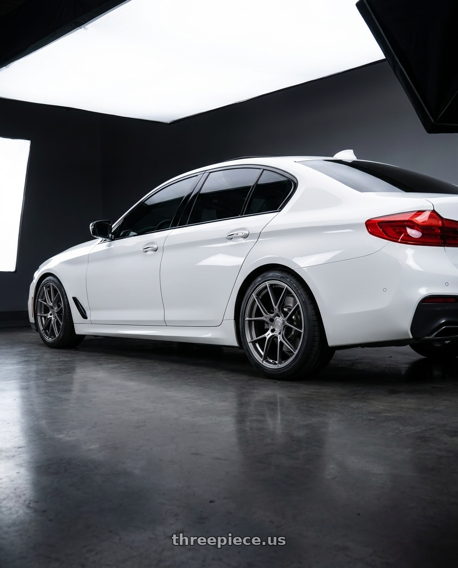 2019 BMW 540i Msport with Aodhan AH-11 5x112 18x8.5+35 Hyper Black wheels rear three quarter view square tires