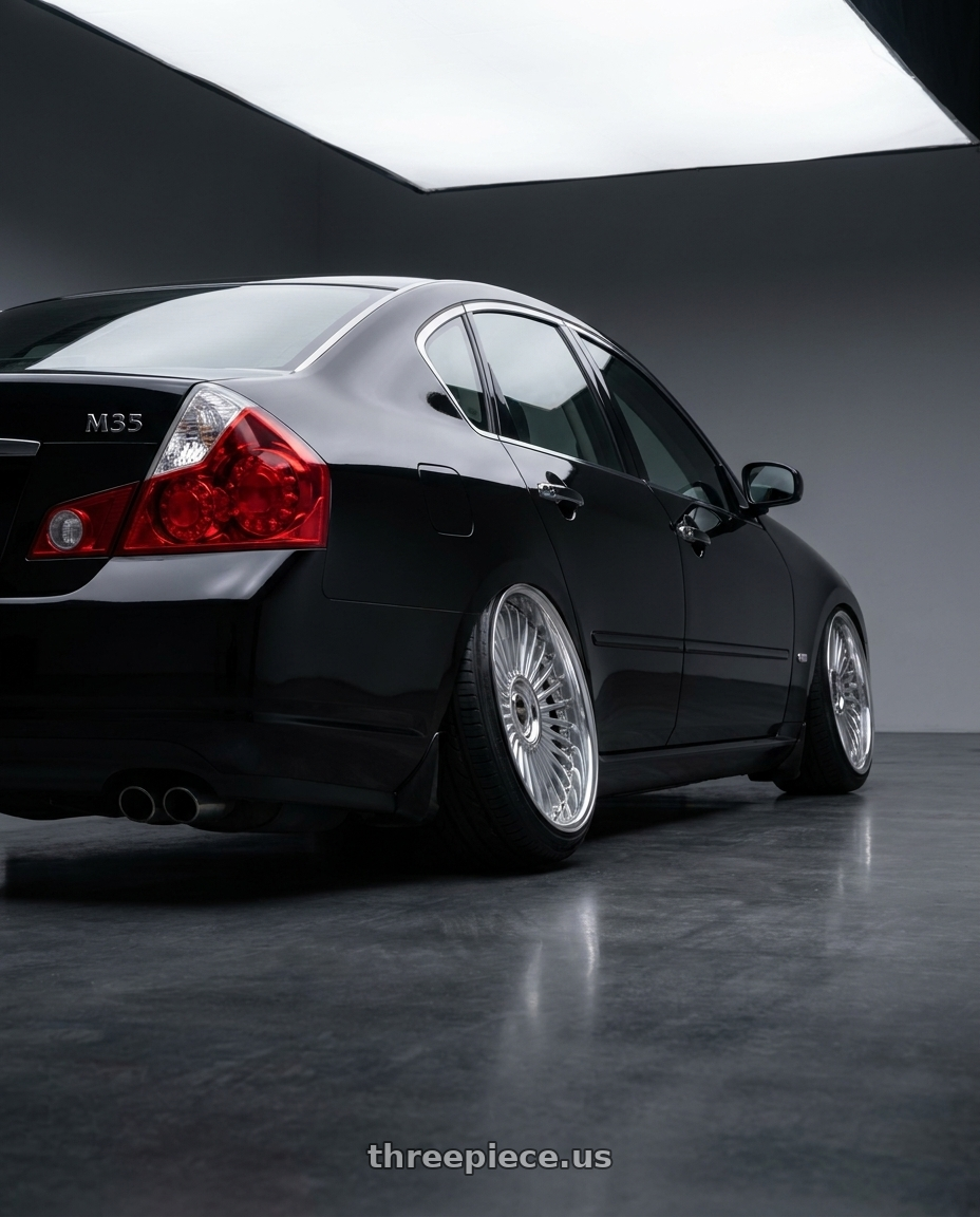 2006 infiniti m35 with Work Emitz wheels rear three quarter view square tires