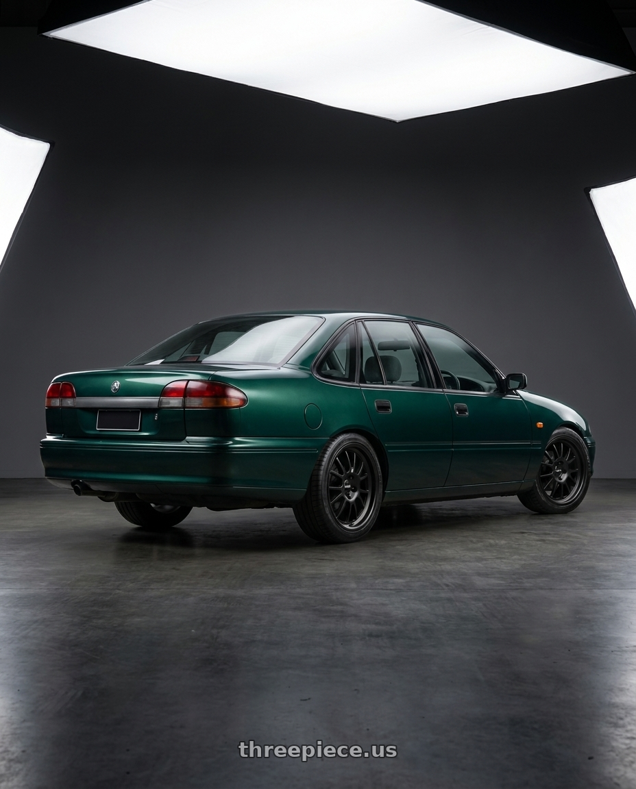 1999 Vs Commodore with Klutch SL14 5x114.3 18x8.5  +35 Matte Black wheels rear three quarter view square tires
