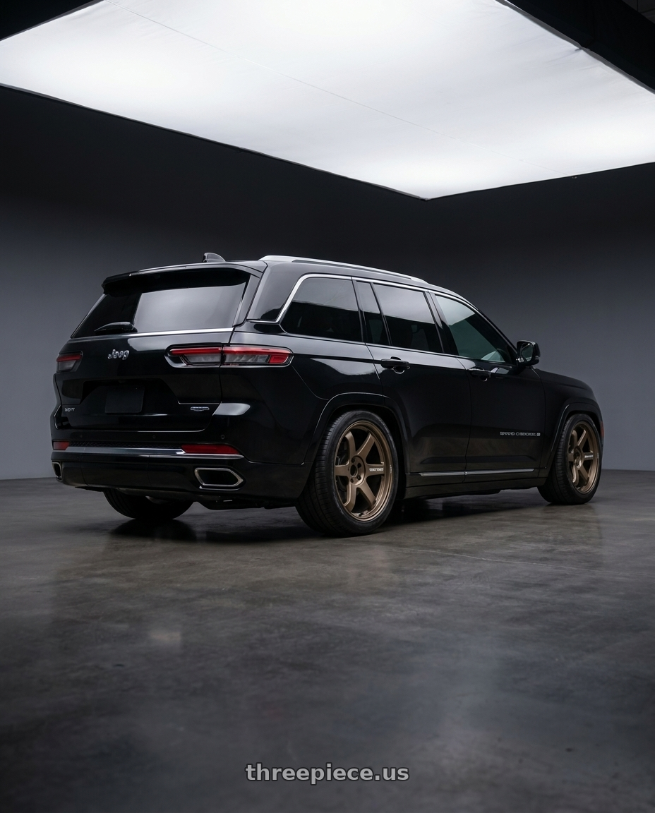 2023 jeep grand cherokee summit with Volk Racing TE37 Ultra M Spec 5x112 19x9.5+23 19x10.5+35 Bronze Almite Toyota Supra MK5 Spec wheels rear three quarter view slight stretch tires