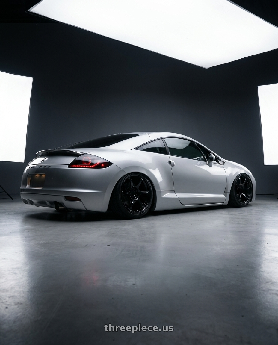 2010 Mitsubishi Eclipse with Advan RGII 5x114.3 19x10+35 Gloss Black wheels rear three quarter view slight stretch tires