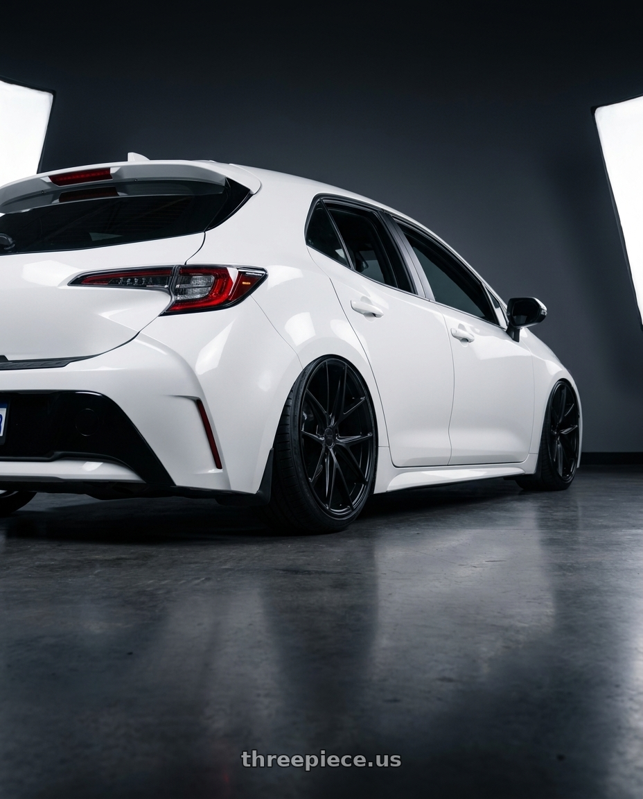 2023 Toyota Corolla Hatchback with Niche 1PC M117 MISANO 5X114.3 18X9.5 +40 MATTE BLACK wheels rear three quarter view slight stretch tires