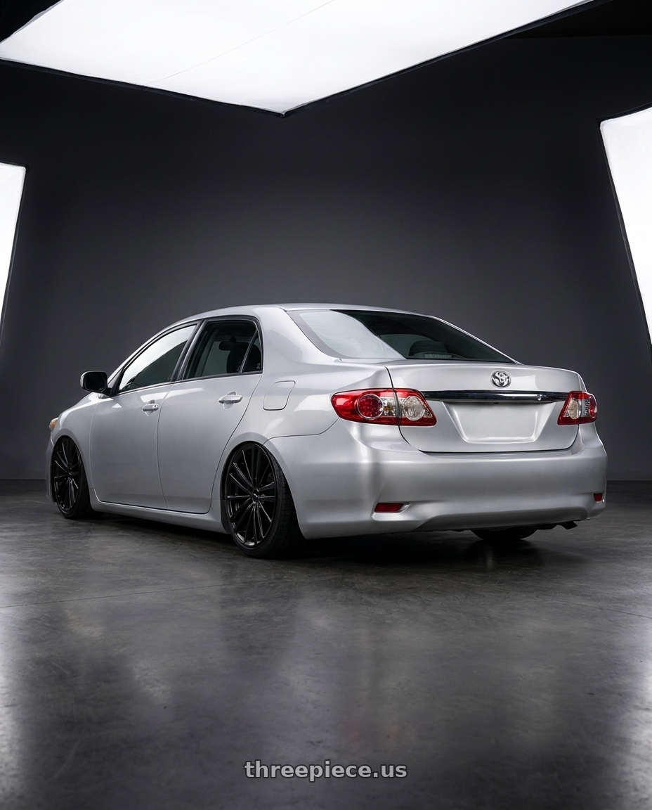 2011 Toyota Corolla with RTX Cosmos 5x100 17x7.5 +42 Satin Black wheels rear three quarter view slight stretch tires