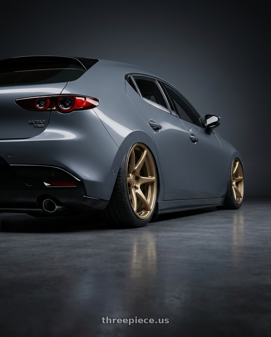 2023 Mazda Mazda3 Turbo with Kansei K11B Tandem 5x114.3 18x9 12 Bronze wheels rear three quarter view slight stretch tires