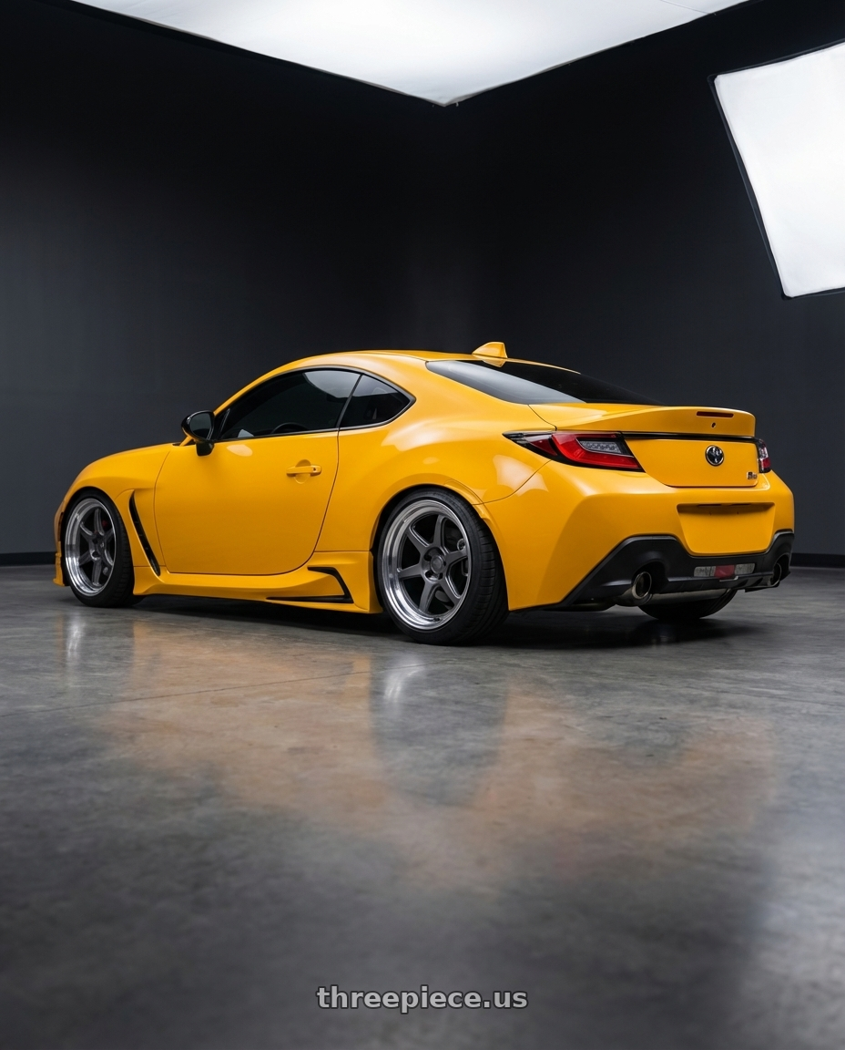 2026 GR86 yuzu edition with Kansei K14G Roku 5X100 18x9.5 38 Grey and Machined Lip wheels rear three quarter view slight stretch tires