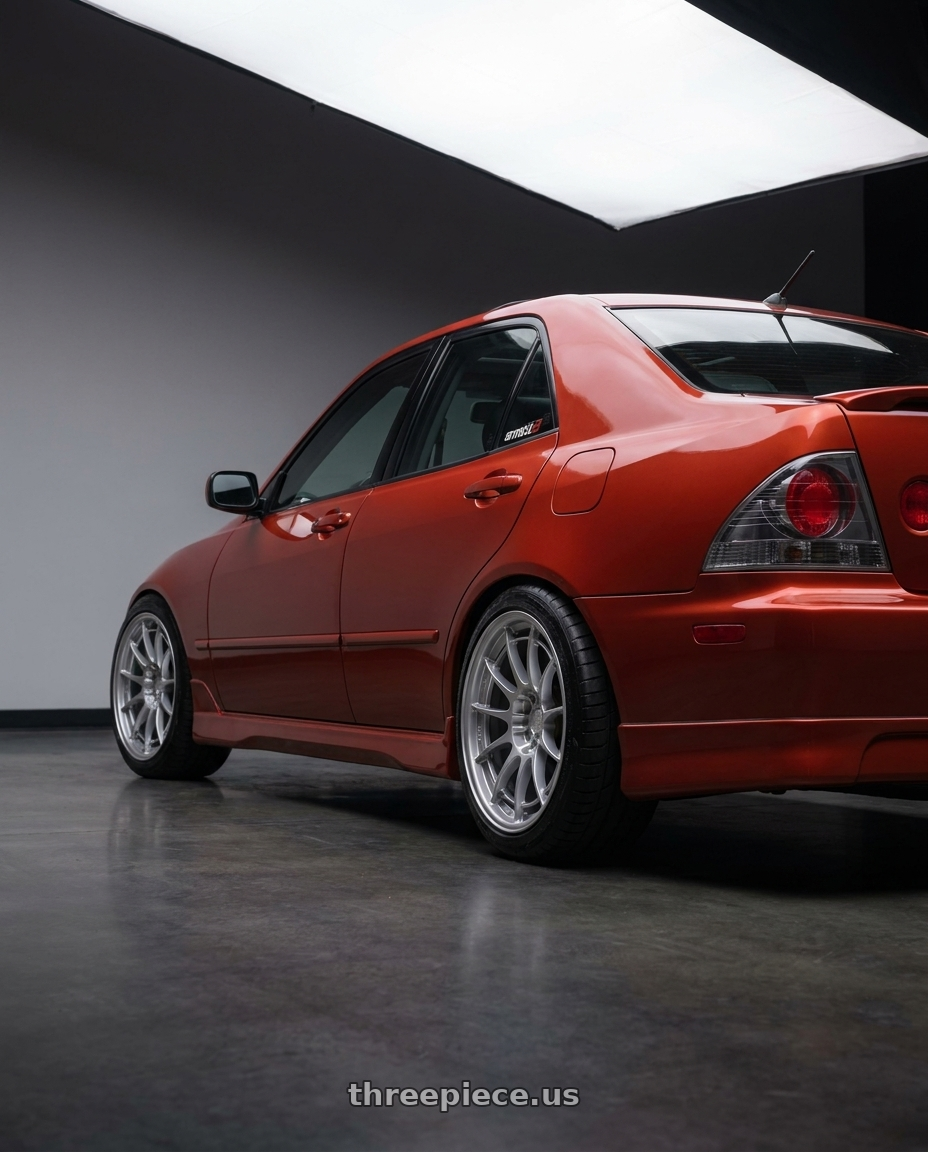 2001 Lexus IS300 Auburn Sky with Enkei NT03+M 5x114.3 18x7.5+42 Hyper Silver wheels rear three quarter view meaty tires