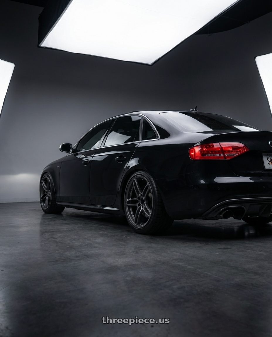 2011 Audi S4 with Volk Racing NE24 5x120 19x9.5 +35 MATTE GUNBLACK wheels rear three quarter view slight stretch tires