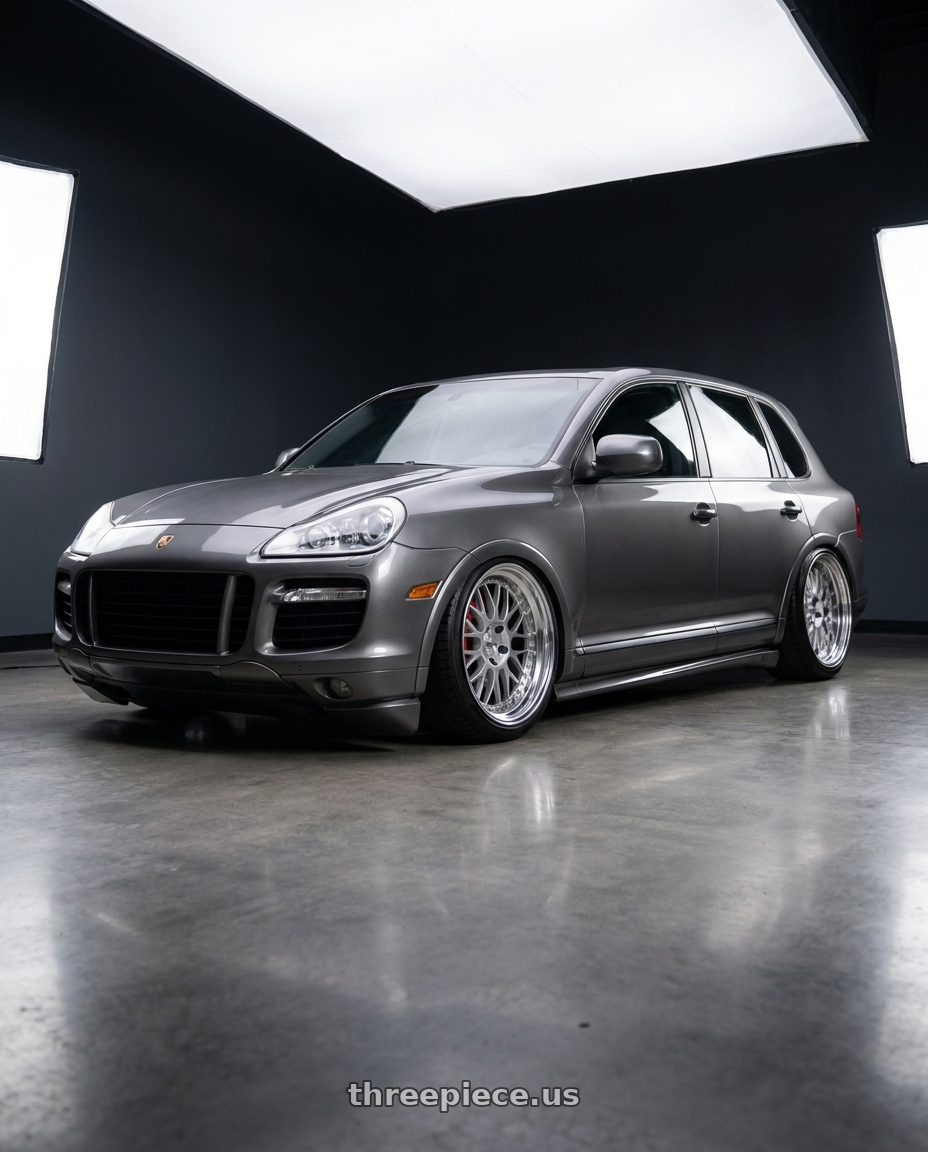 2005 Porsche Cayenne Turbo with Work Meister M1 3p 5x130 18x10+53 H Disk Silver wheels front three quarter view slammed stance
