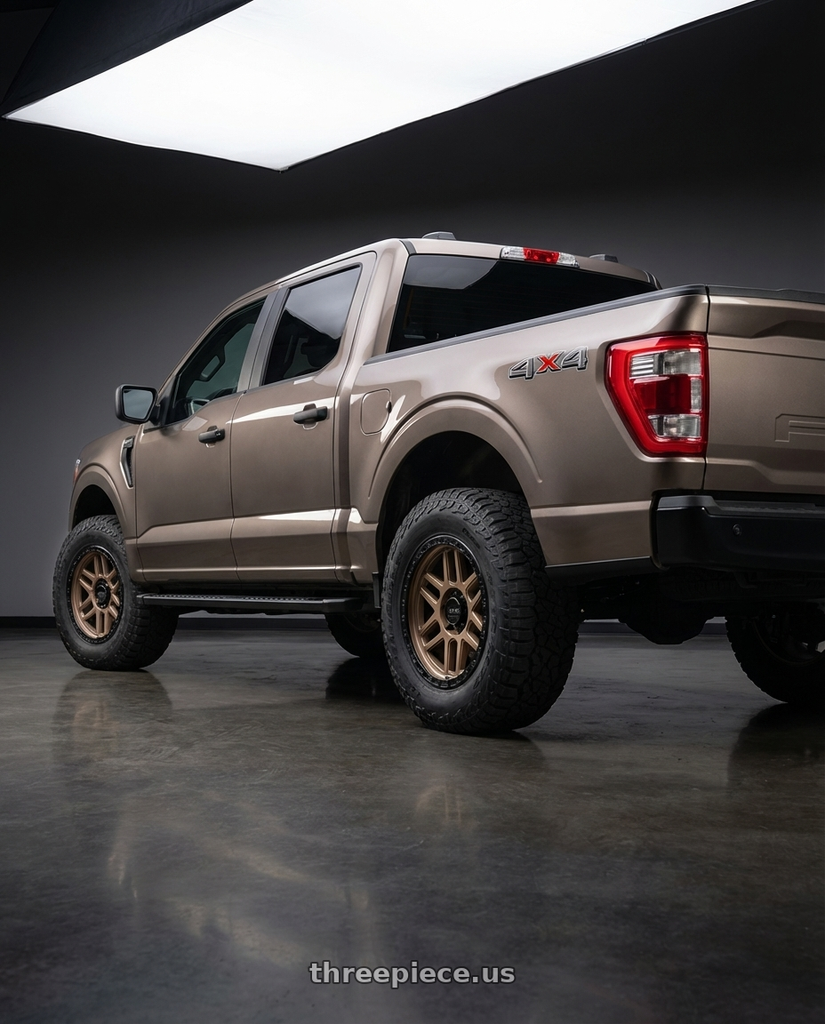 2019 Ford F-150 with KMC KM544 MESA 6X135 20X9 +18 MATTE BRONZE WITH BLACK LIP wheels rear three quarter view meaty tires