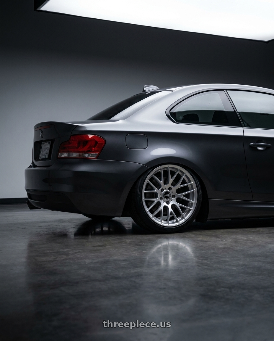 2012 BMW 1 Series E82 with Avant Garde Wheels M359 5X120 18x9.5 +45 Hyper Silver wheels rear three quarter view slight stretch tires