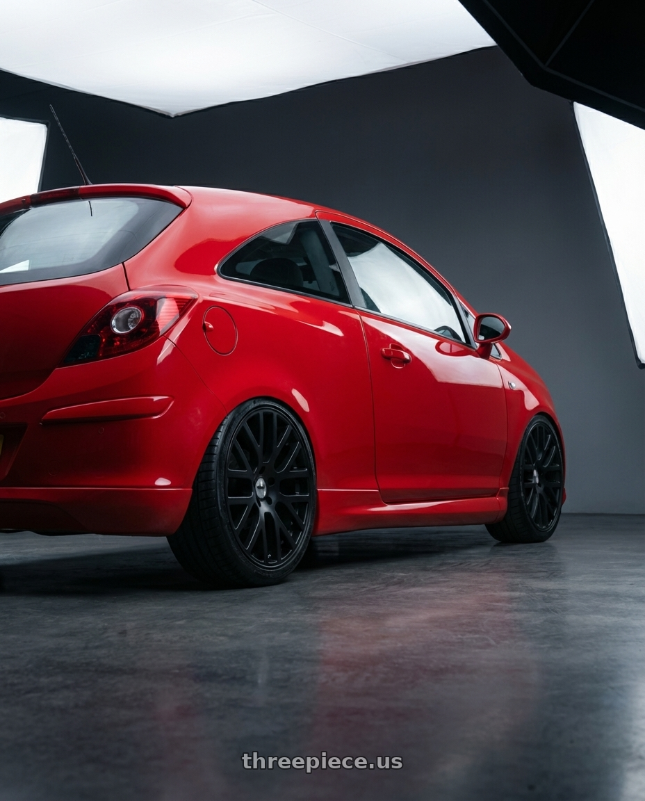 Opel Corsa D 2010  with TSW DONINGTON 4X100 17X7 +40 MATTE BLACK wheels rear three quarter view square tires