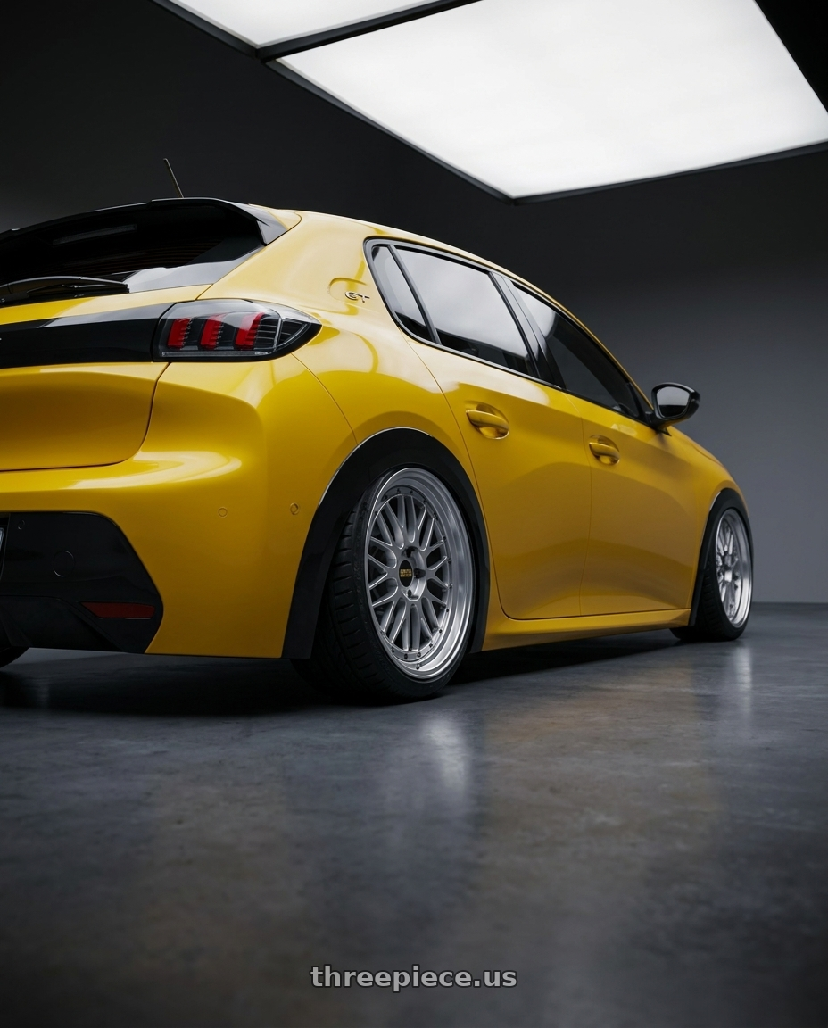 2021 Peugeot 208 with BBS LM 5x120 17x8.5+18 Diamond Silver wheels rear three quarter view slight stretch tires
