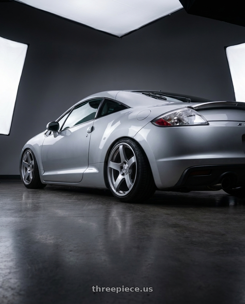 2010 Mitsubishi Eclipse with Ssr Gtv01 5x114.3 18x8.5+40  GLARE SILVER wheels rear three quarter view slight stretch tires