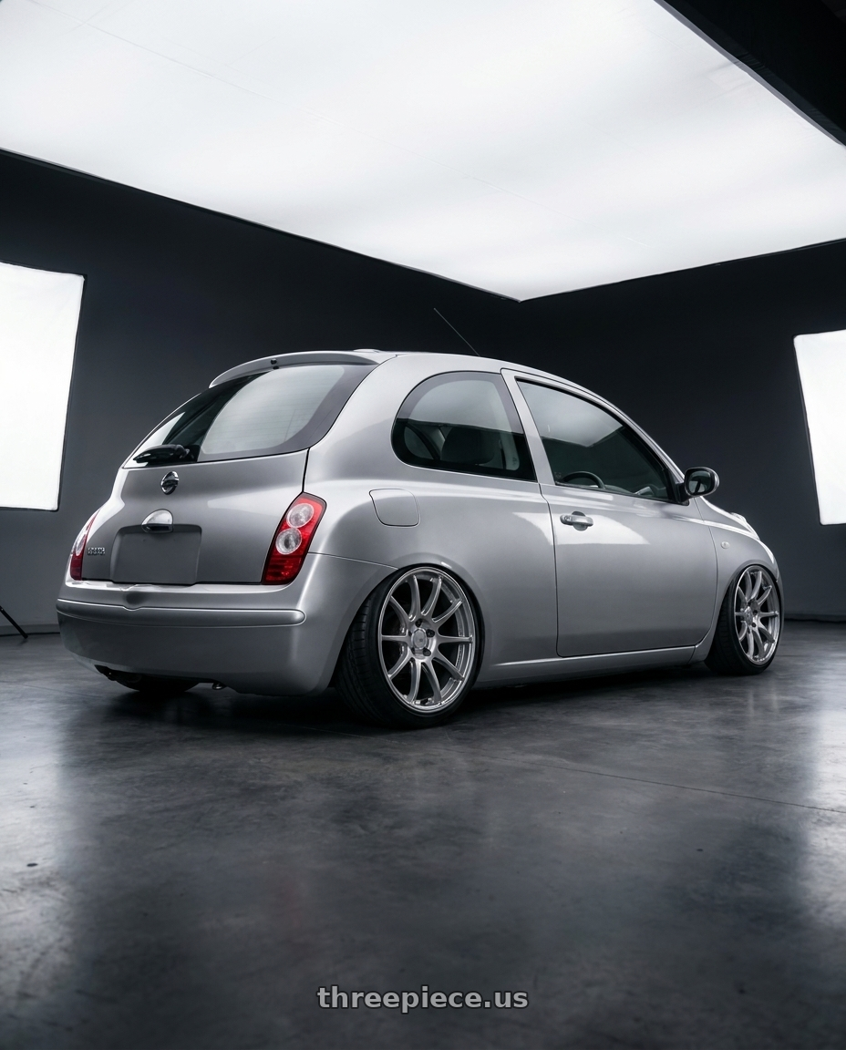 2003 Nissan Micra with Ssr Gtv02 4x100 17x7+42  GLARE SILVER wheels rear three quarter view slight stretch tires