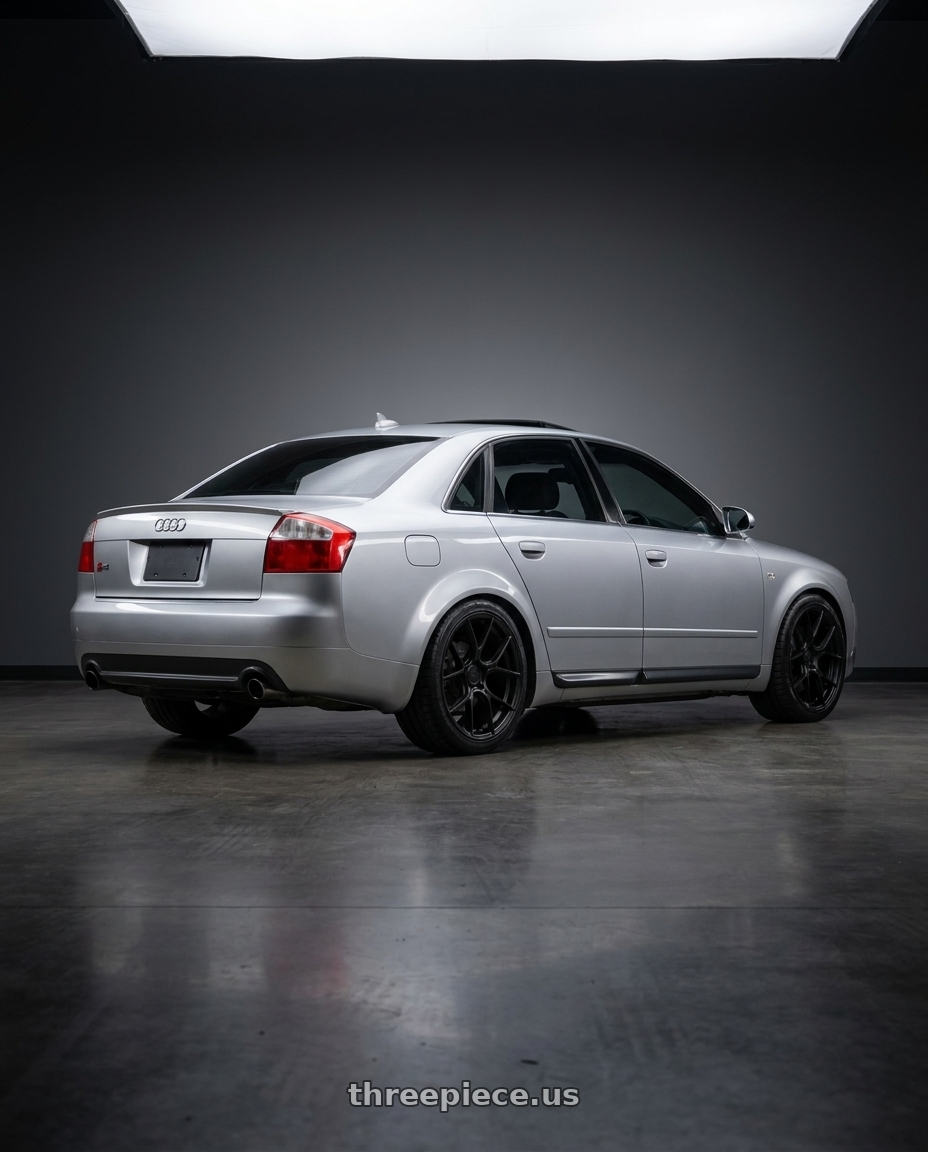 Silver 2005 Audi S4 with Aodhan AH-11 5x112 18x8.5+35 Matte Black wheels rear three quarter view square tires