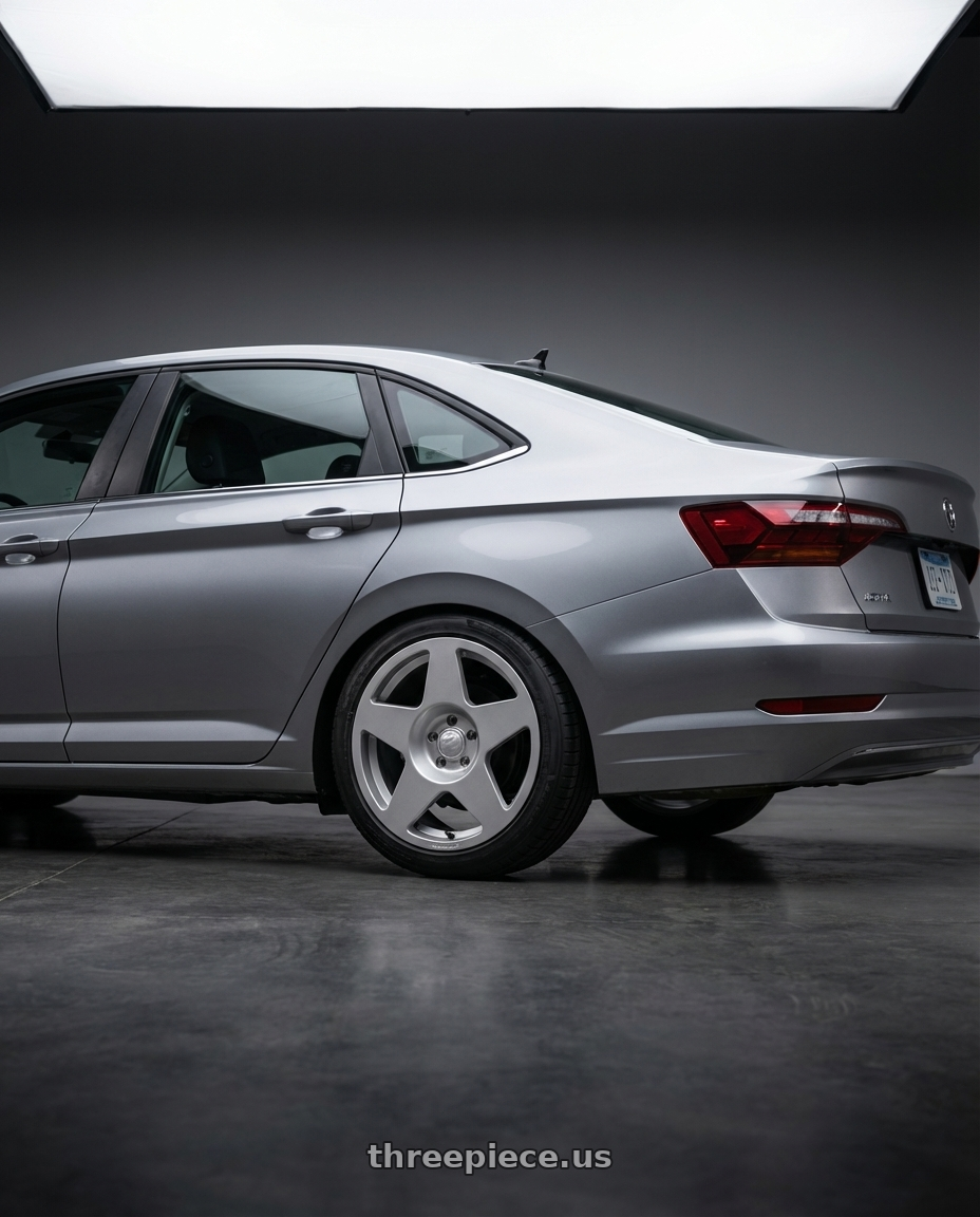 2024 Volkswagen jetta  with fifteen52 Tarmac 5x112 18X8.5 +45 SPEED SILVER (GLOSS SILVER) wheels rear three quarter view square tires