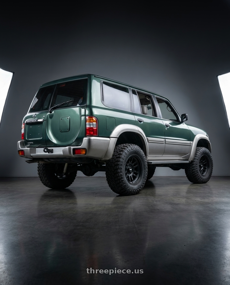 2001 Nissan Patrol with Dirty Life Canyon 9310 6x139.7 17x9-12 Matte Black wheels rear three quarter view meaty tires