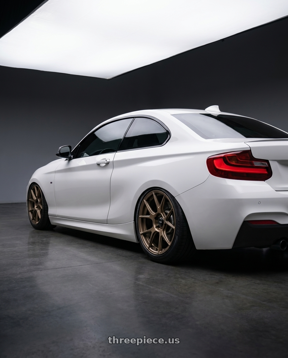 2018 BMW 2 Series F22 with Konig Ampliform 5x120 19x10+28 Gloss Bronze wheels rear three quarter view slight stretch tires