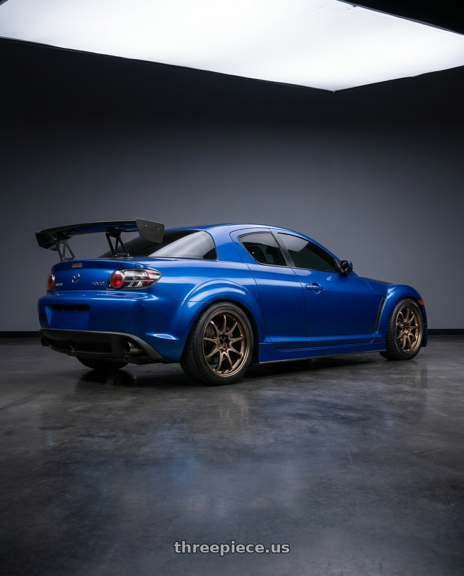2005 mazda rx8 with Volk Racing CE28N-PLUS 5x120 18x9.5 +38 SHINING BRONZE METAL wheels rear three quarter view square tires