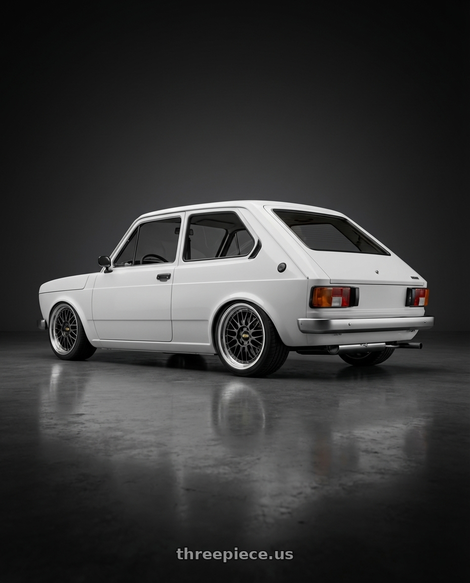 1979 fiat 147 with BBS LM 5x130 18x10 +65 Diamond Black Center w/ Machined Lip wheels rear three quarter view square tires