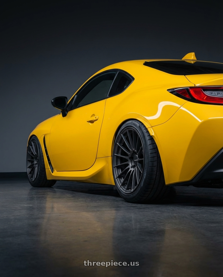 2026 Subaru BRZ Series.Yellow with Enkei RS05-RR 5x100 18x8.5+42 Matte Gunmetal wheels rear three quarter view meaty tires