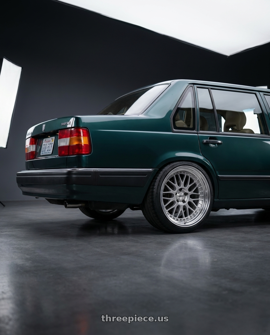 1991 volvo 940 se with Work Meister M1 3p 5x108 16x6.5+24 O Disk Silver wheels rear three quarter view square tires