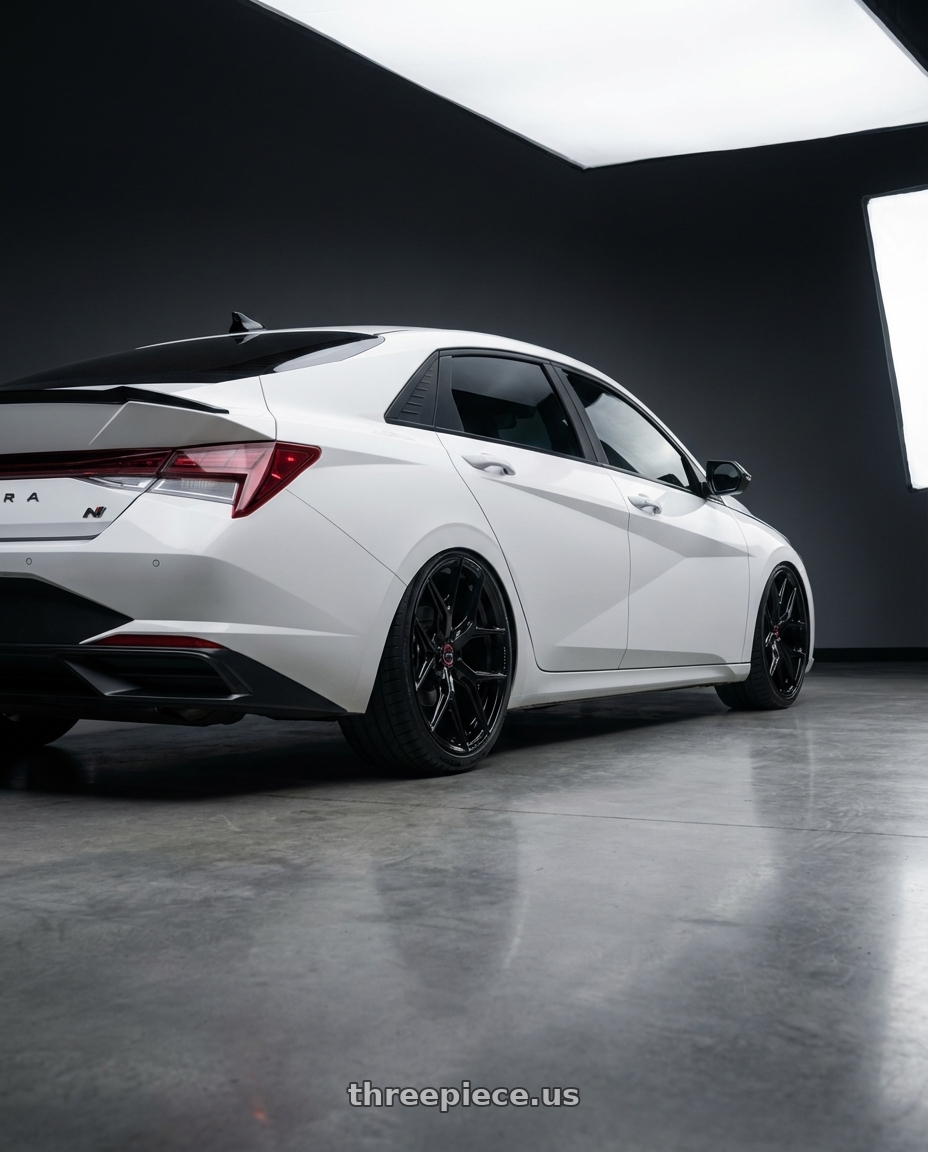 2024 Hyundai Elantra N with Vossen HF-5 19x8.5 / 5x114.3 / ET32 / Flat Face / 73.1 - Gloss Black Wheel - HF5-9N60 wheels rear three quarter view slight stretch tires