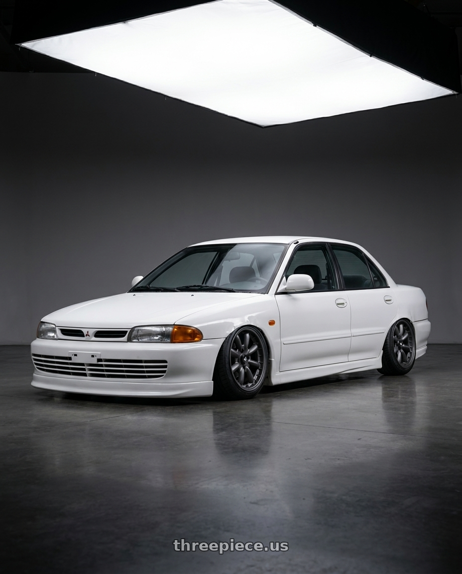 1993 Mitsubishi lancer cab with Enkei Compe 4x114.3 16x8+0 Matte Gunmetal wheels