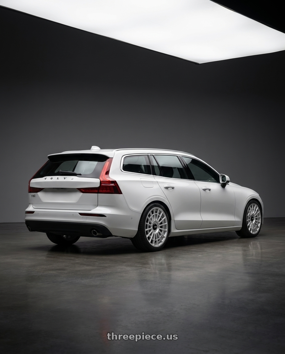 2025 Volvo V60 with Rotiform 1PC R134 FLG 5X120 18X8.5 +35 GLOSS SILVER wheels rear three quarter view square tires