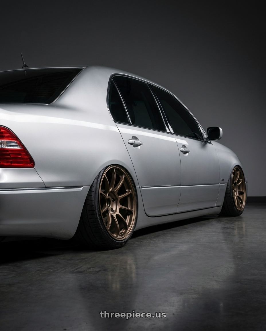 2004 lexus ls430 with Volk Racing ZE40 M-SPEC 5x114.3 19x9.5 +35 BRONZE wheels rear three quarter view extreme stretch tires
