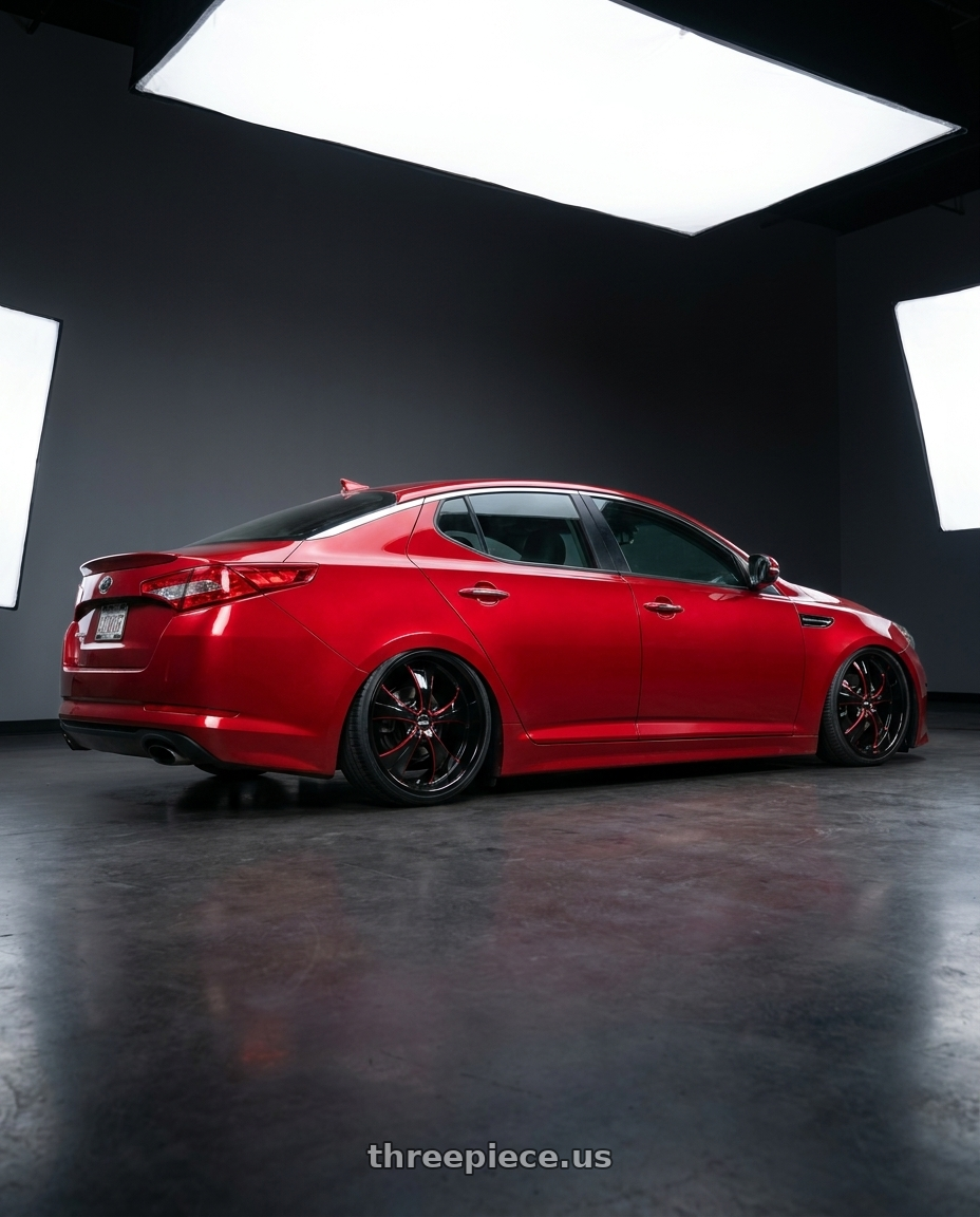 2012 Kia Optima with Strada Street Classics Old Skool 6x139.7 24x10 +24 Gloss Black Candy Red Milled wheels rear three quarter view square tires