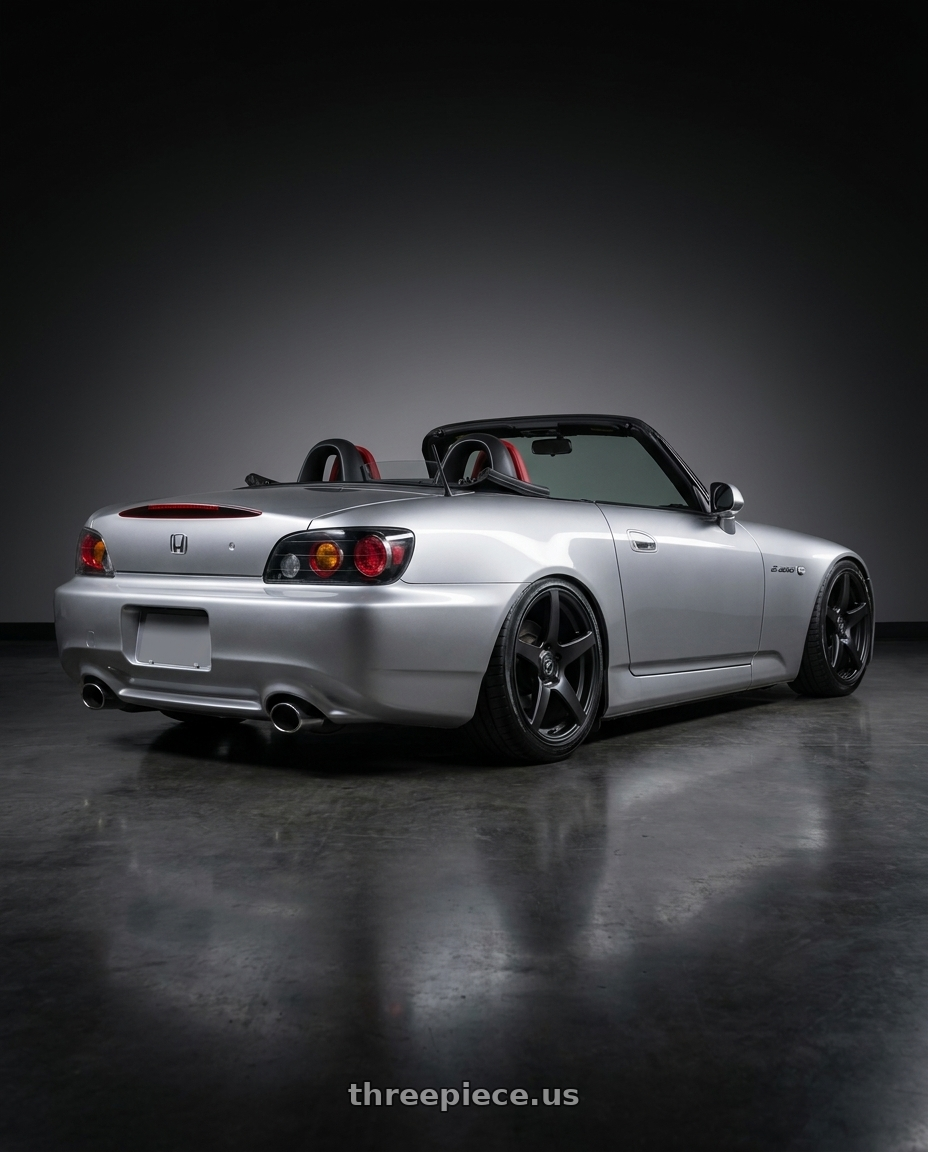 2009 Honda S2000 with Forgestar CF5 5x114.3 18x10 +42 Satin Black wheels rear three quarter view slight stretch tires