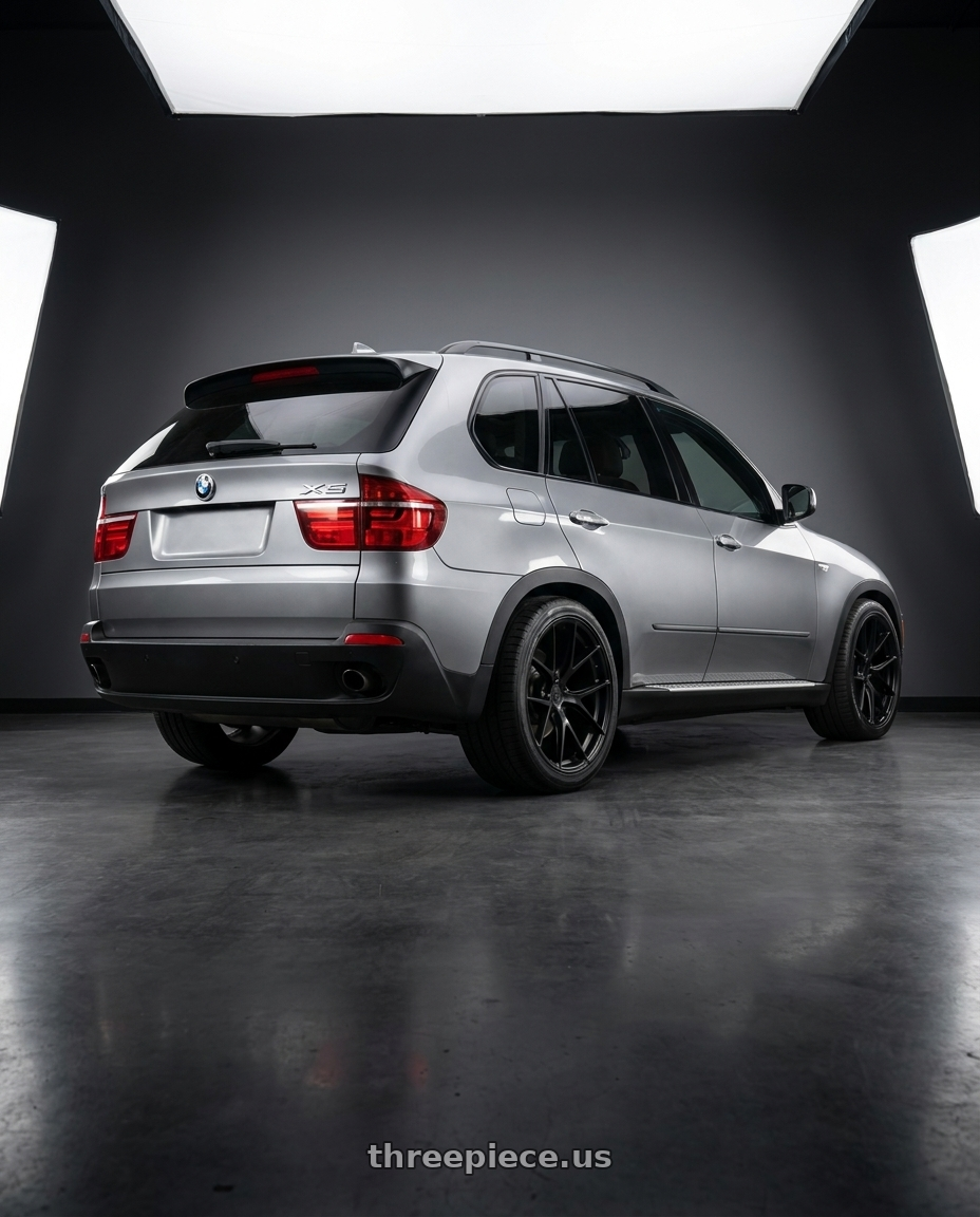 2010 BMW x5 silver with Aodhan AFF7 5x120 20x10.5+35 Matte Black wheels rear three quarter view square tires