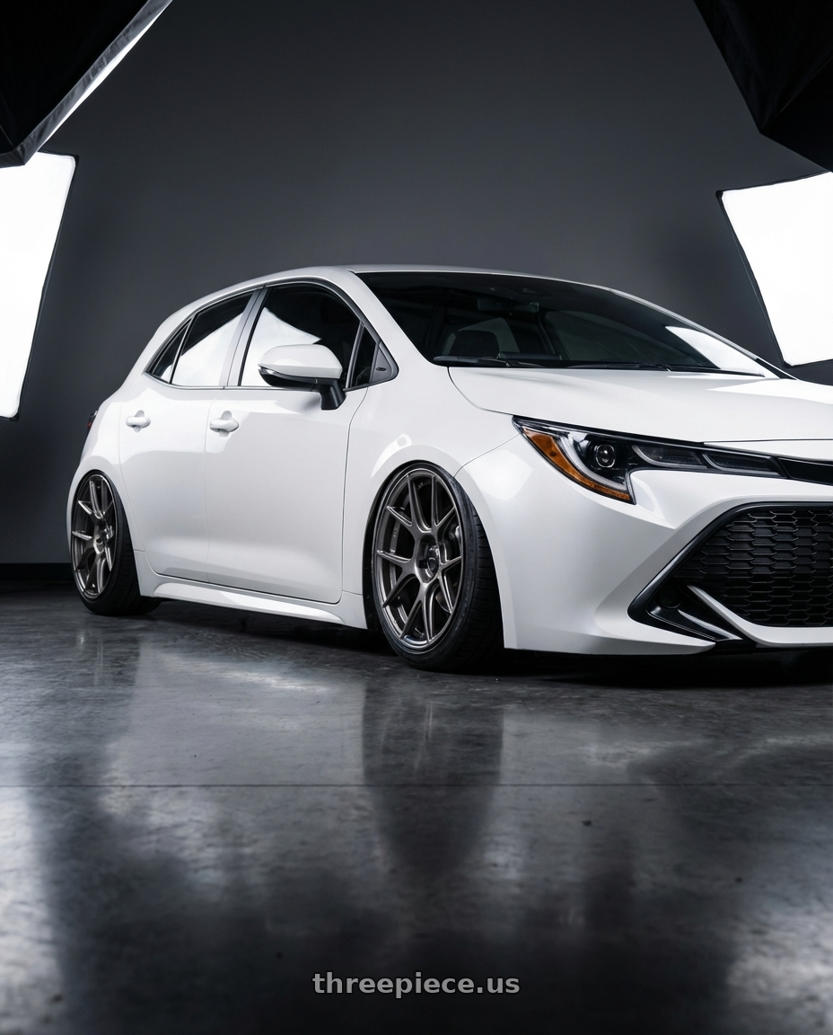 2023 Toyota Corolla Hatchback with Konig Ampliform 5x114.3 18x9.5+25 Dark Metallic Graphite wheels