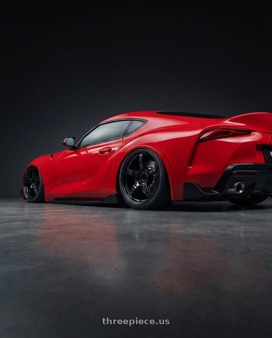 2023 Toyota GR Supra with Gram Lights 57CR 5x112 19x8.5+45 Glossy Black wheels rear three quarter view slight stretch tires