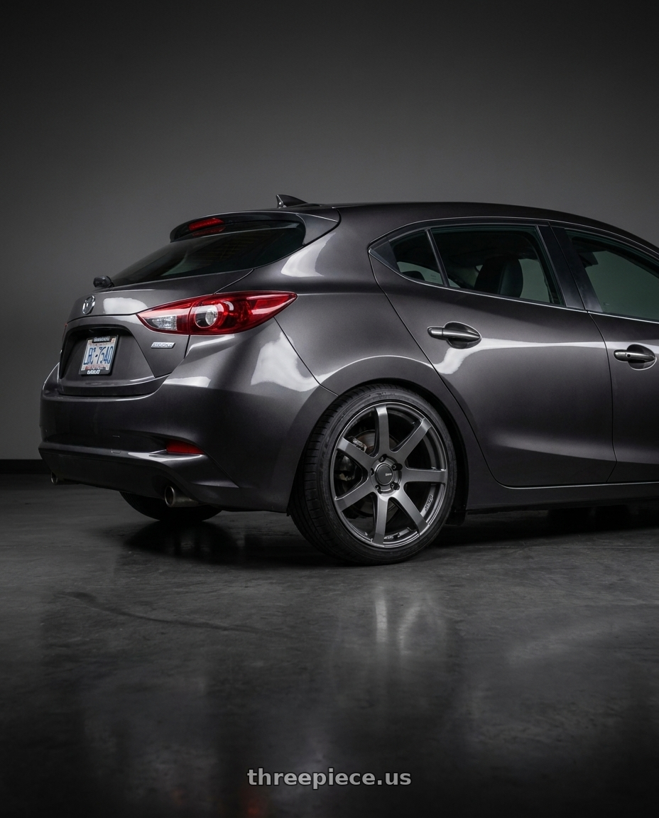2017 Mazda Mazda3 Grand Touring with Enkei PF07 5x114.3 18x8+45 Dark Silver wheels rear three quarter view square tires