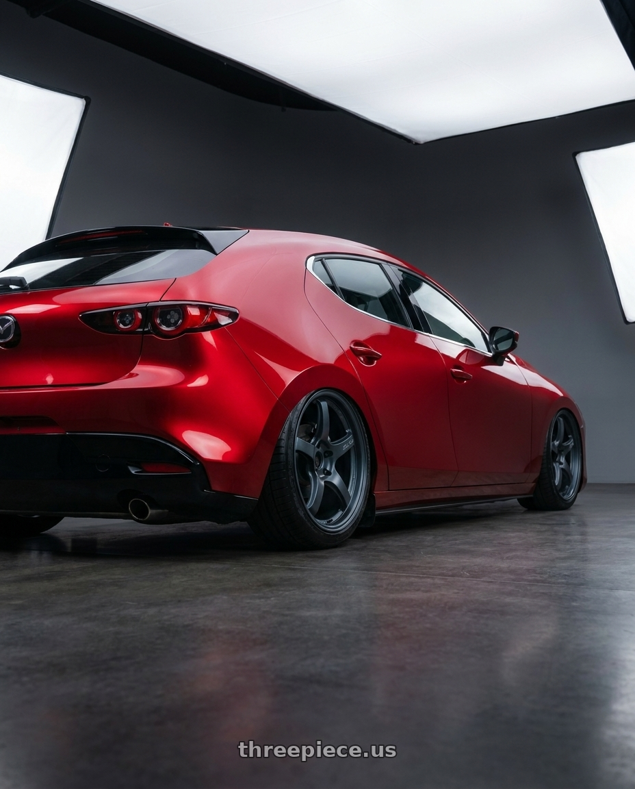 2021 Mazda3 5D with Gram Lights 57CR 5x112 19x10.5+22 Gunblue II wheels rear three quarter view slight stretch tires